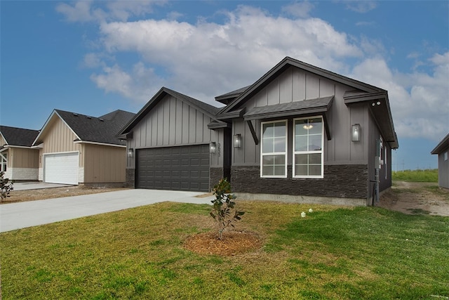 3633 Rebecca Dr, Corpus Christi, TX 78410 - view of front of property featuring concrete driveway, a garage, board and batten siding, and a front lawn