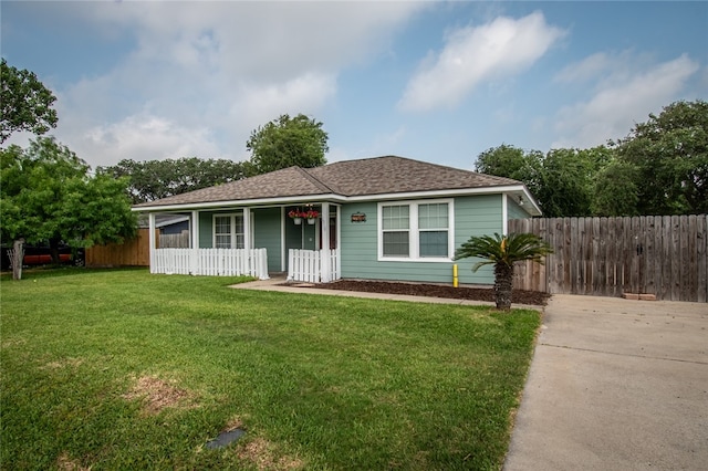 view of front of house featuring a front yard and covered porch