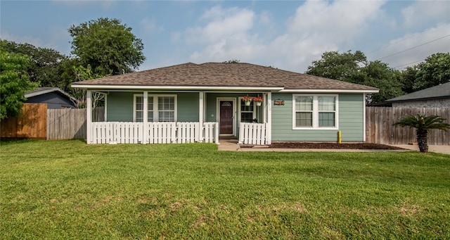 view of front of home with a front lawn and covered porch