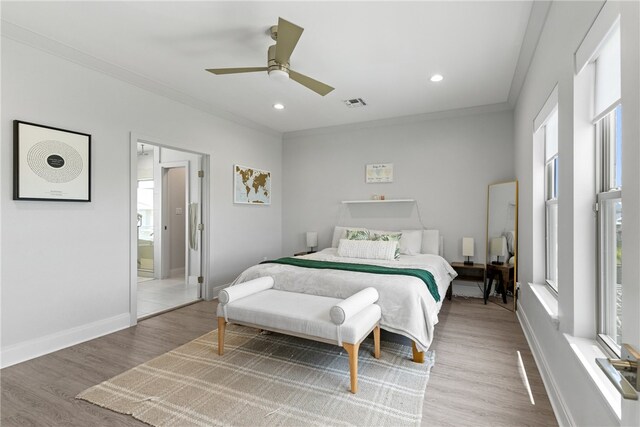 15130 Reales Dr, Corpus Christi, TX 78418 - bedroom featuring crown molding, multiple windows, light wood-style flooring, a ceiling fan, and recessed lighting