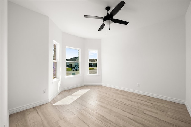 empty room with light hardwood / wood-style flooring and ceiling fan