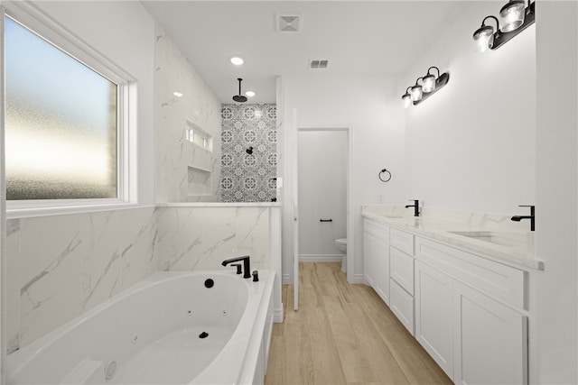 4129 Azali Dr, Corpus Christi, TX 78414 - full bath featuring a whirlpool tub, wood finished floors, a tile shower, recessed lighting, and double vanity