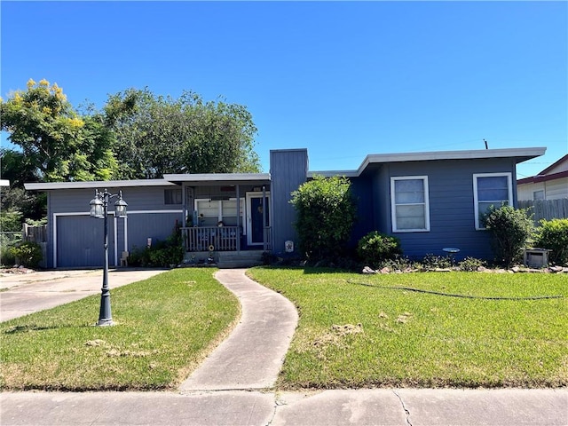 view of front facade featuring a garage, a porch, and a front lawn