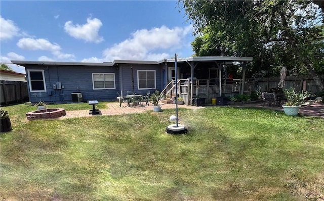 729 Chase Dr, Corpus Christi, TX 78412 - view of front of property featuring an outdoor fire pit, a patio, and central AC unit