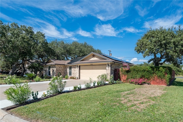 ranch-style home featuring a garage and a front yard