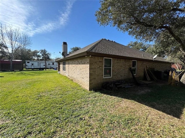 view of home's exterior with a yard