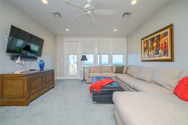 living room with ceiling fan and light colored carpet