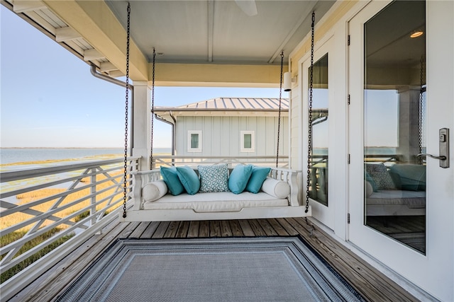 balcony featuring a water view