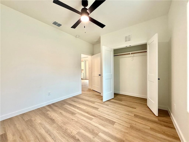 unfurnished bedroom featuring a closet, ceiling fan, and light hardwood / wood-style flooring