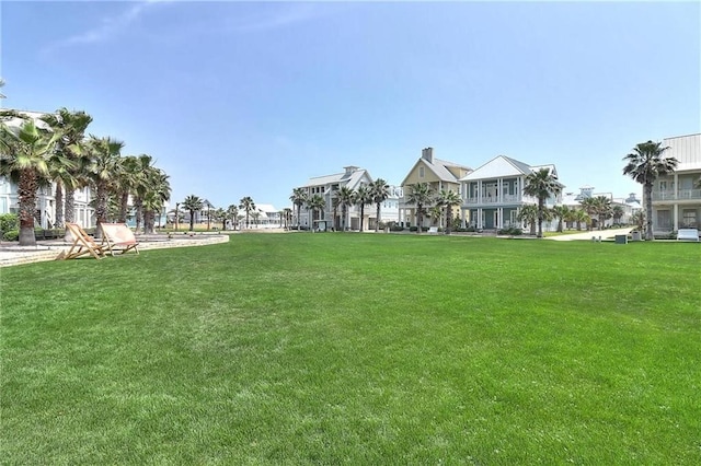 view of home's community featuring a lawn