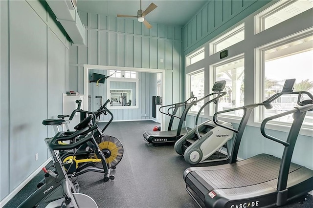 exercise room with ceiling fan and a wealth of natural light