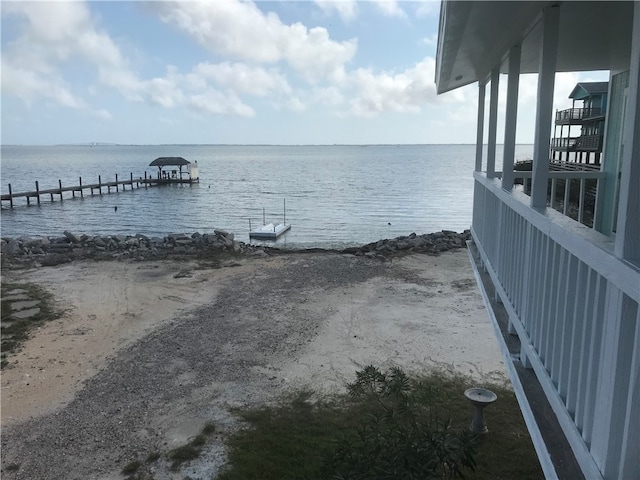 property view of water featuring a beach view