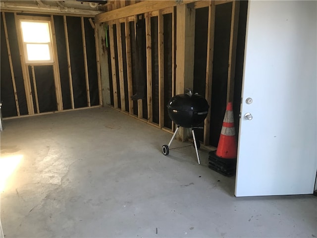 bathroom featuring toilet, tile patterned floors, and a shower with shower door