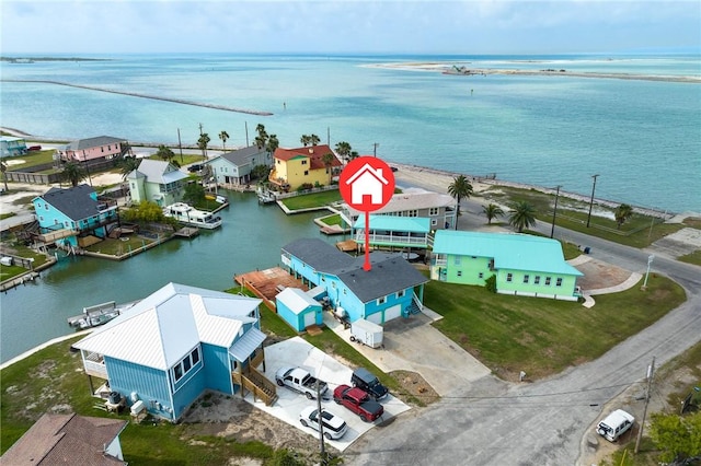 bird's eye view with a water view and a residential view