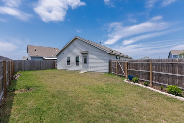 13245 Wrangler St, Robstown, TX 78380 - back of house featuring a yard and a fenced backyard