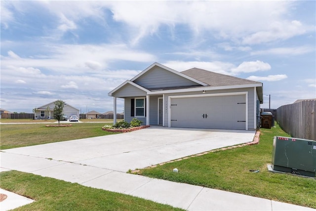 13245 Wrangler St, Robstown, TX 78380 - craftsman house with a front lawn, concrete driveway, fence, and a garage