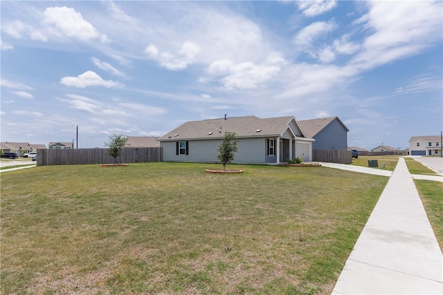13245 Wrangler St, Robstown, TX 78380 - view of front of house with concrete driveway, a front yard, an attached garage, and fence