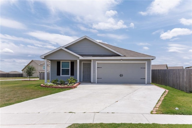13245 Wrangler St, Robstown, TX 78380 - ranch-style house with concrete driveway, a front lawn, fence, and an attached garage