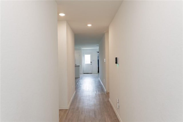 13245 Wrangler St, Robstown, TX 78380 - corridor with light wood-style floors, baseboards, and recessed lighting