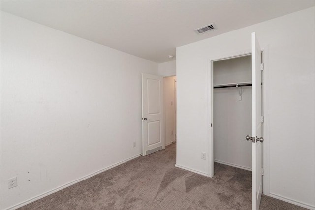 13245 Wrangler St, Robstown, TX 78380 - unfurnished bedroom featuring baseboards, carpet flooring, a closet, and visible vents