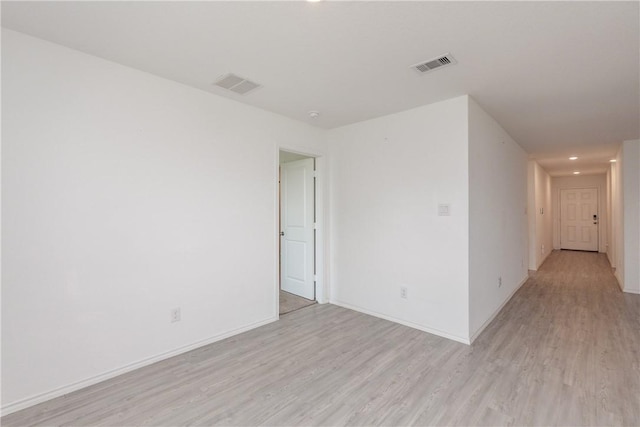 13245 Wrangler St, Robstown, TX 78380 - empty room with light wood finished floors, baseboards, and visible vents