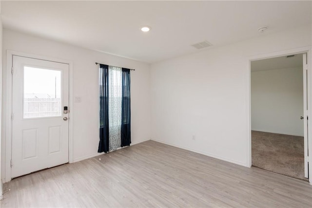 13245 Wrangler St, Robstown, TX 78380 - entryway with baseboards, light wood-style floors, and visible vents