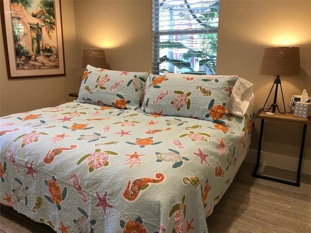 bedroom featuring wood finished floors