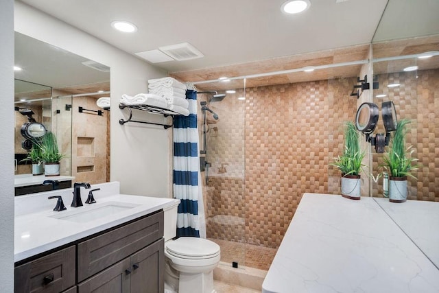 full bathroom with visible vents, a shower stall, vanity, toilet, and recessed lighting
