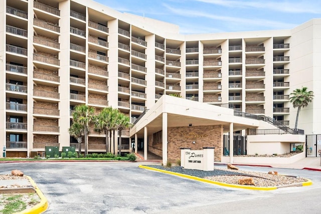 view of property with uncovered parking