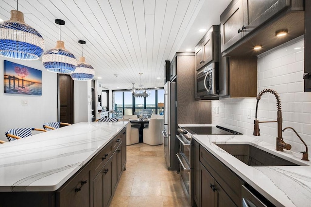kitchen with a sink, a center island, dark brown cabinetry, and stainless steel appliances