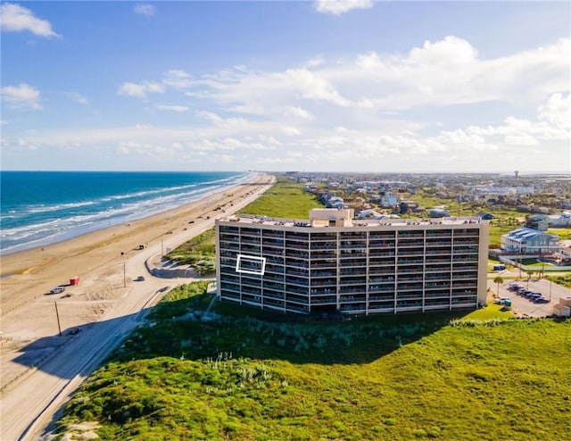 birds eye view of property featuring a water view and a view of the beach