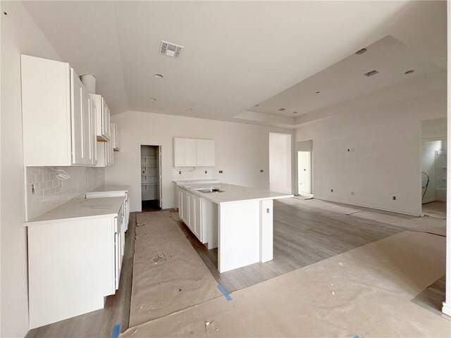 interior space with lofted ceiling and visible vents