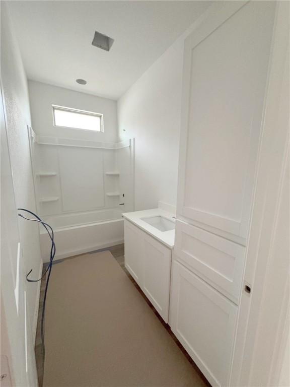 unfurnished room featuring unfinished concrete floors