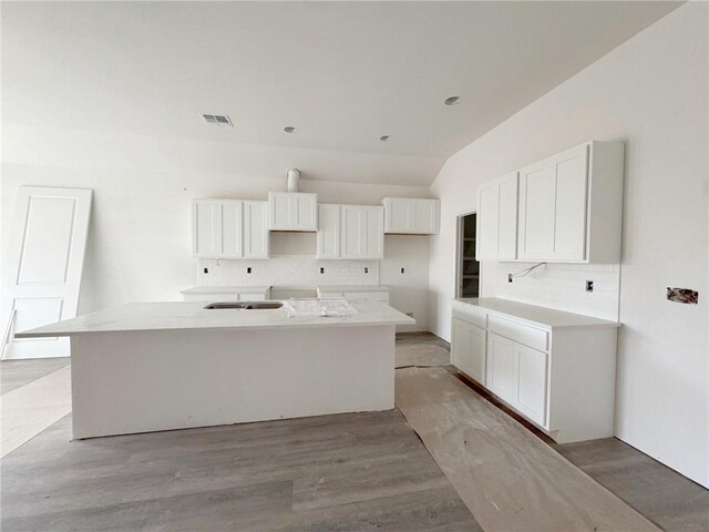unfurnished living room featuring a tray ceiling