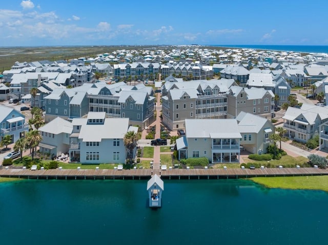 bird's eye view featuring a residential view and a water view