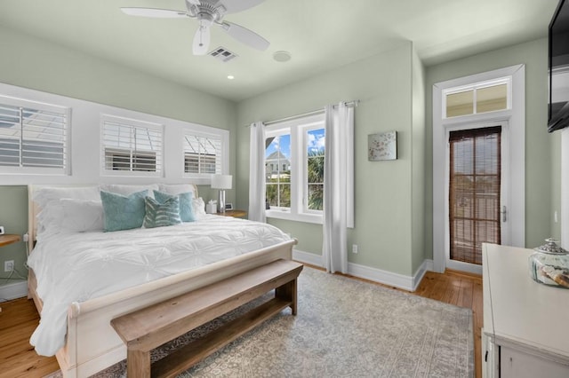 bedroom with recessed lighting, visible vents, ceiling fan, wood finished floors, and baseboards