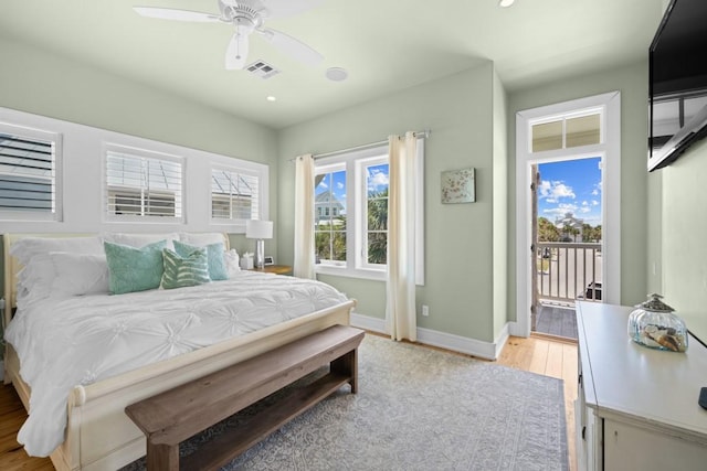 bedroom featuring light wood finished floors, visible vents, a ceiling fan, access to outside, and baseboards