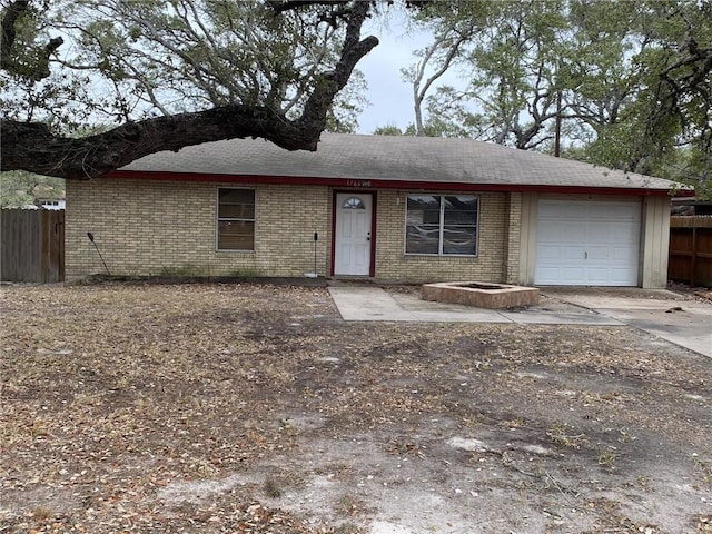 single story home featuring a garage