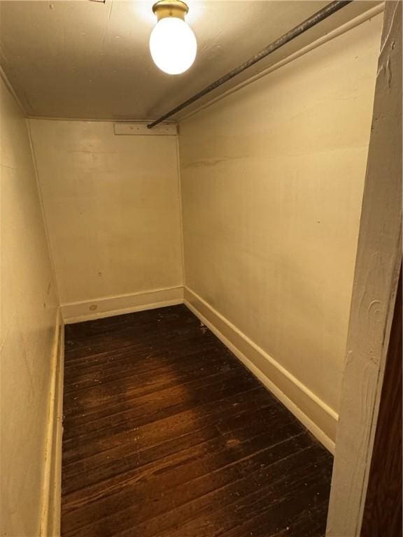 walk in closet featuring dark hardwood / wood-style flooring