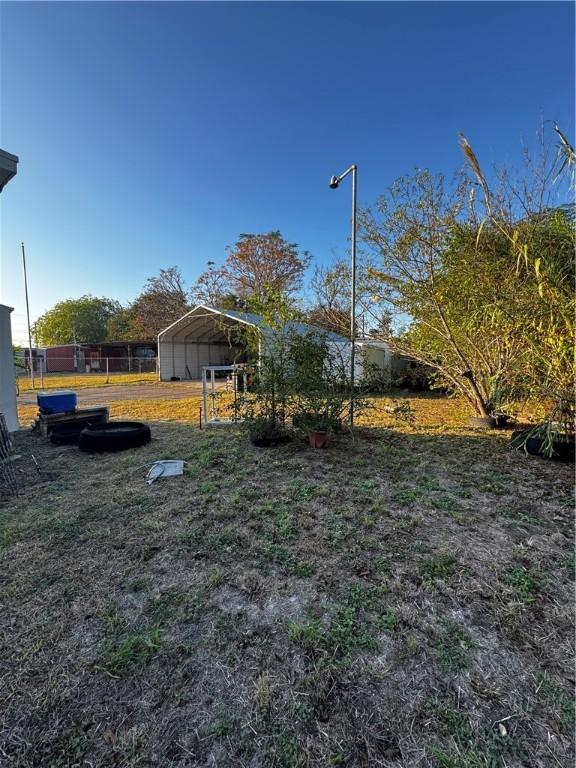 view of yard featuring a carport