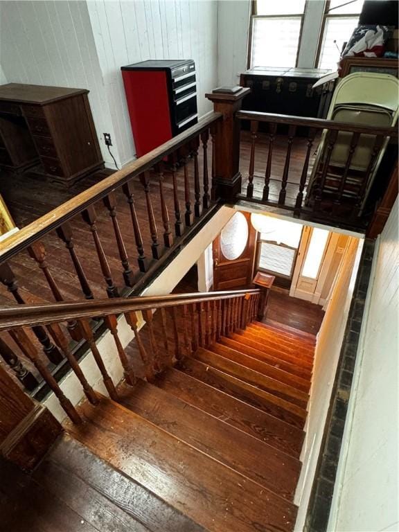 staircase with hardwood / wood-style floors