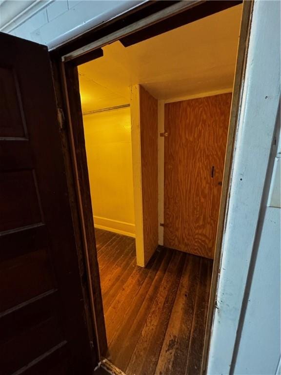 hallway featuring dark hardwood / wood-style flooring