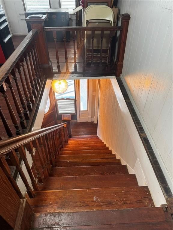 stairway featuring wood-type flooring