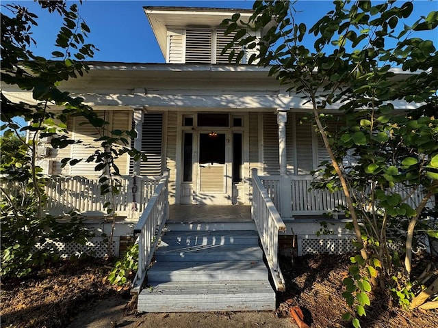 doorway to property with a porch