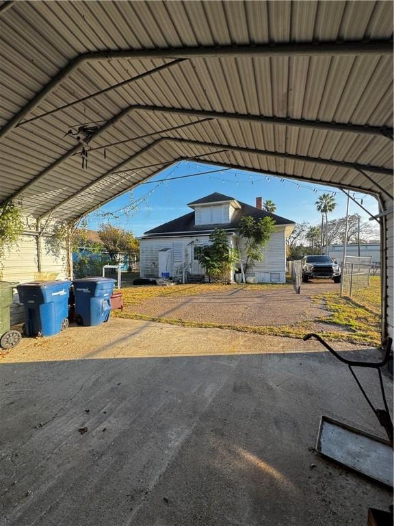 exterior space featuring a carport