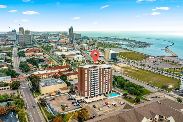drone / aerial view with a city view and a water view