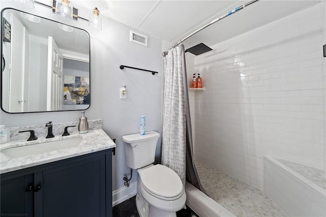 bathroom featuring toilet, visible vents, tiled shower, and vanity