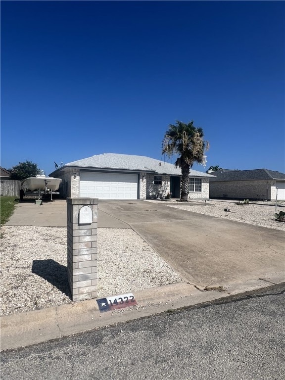 14322 Scallop St, Corpus Christi, TX 78418 - ranch-style home featuring driveway and an attached garage