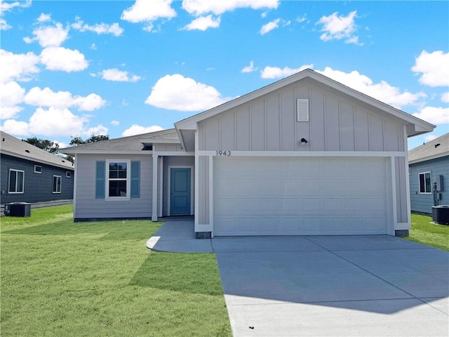 ranch-style house with board and batten siding, a front lawn, central AC, a garage, and driveway