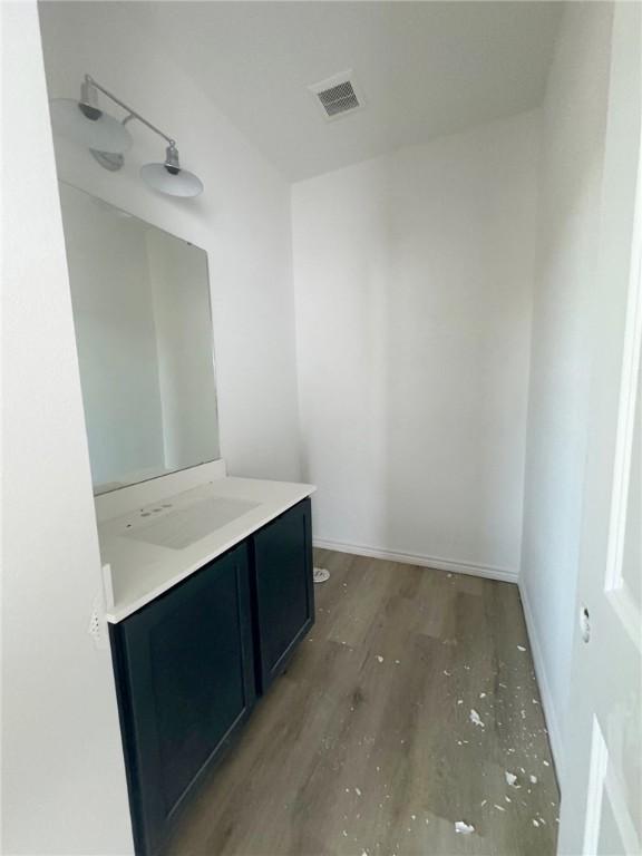 bathroom featuring hardwood / wood-style flooring and vanity